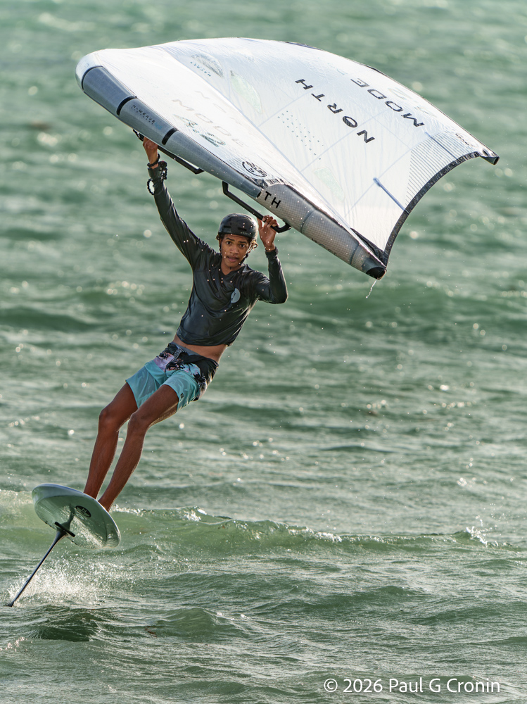 Idani Edwards does a nice smooth jibe just after sunrise In Dutchmans Bay Antigua